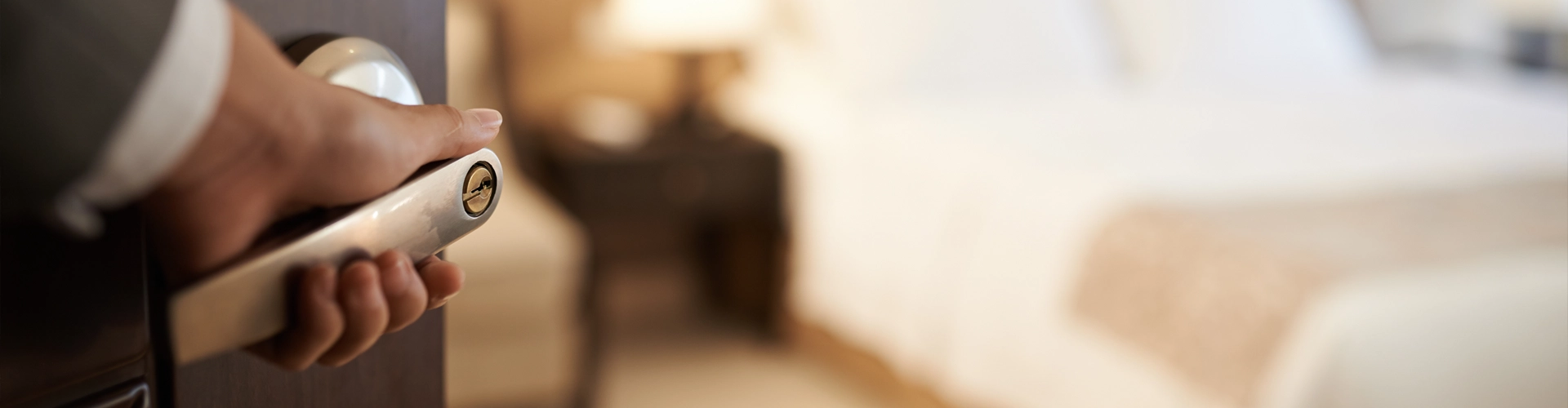 Man walking into an SS hotel room